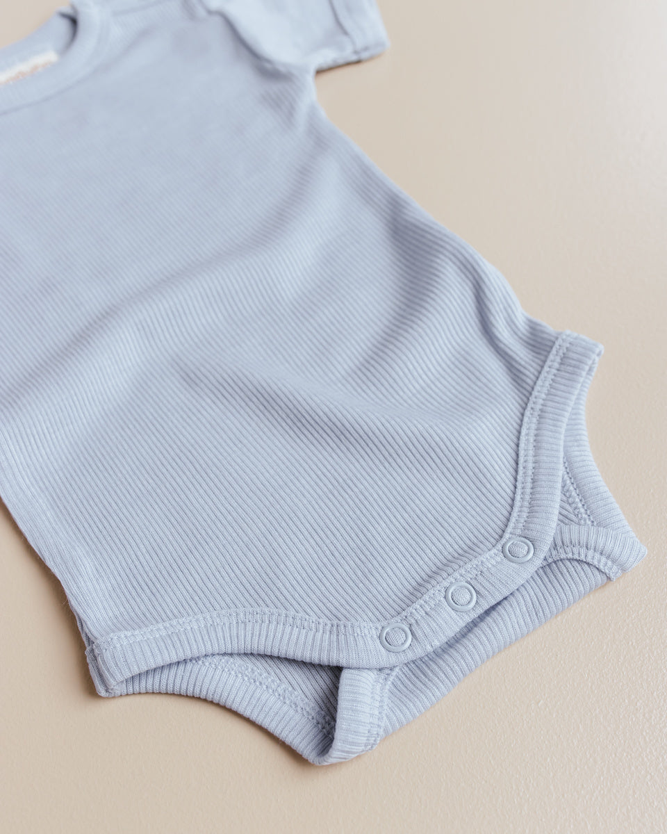 unaduna baby romper wol:zijde lichtblauw blue bird