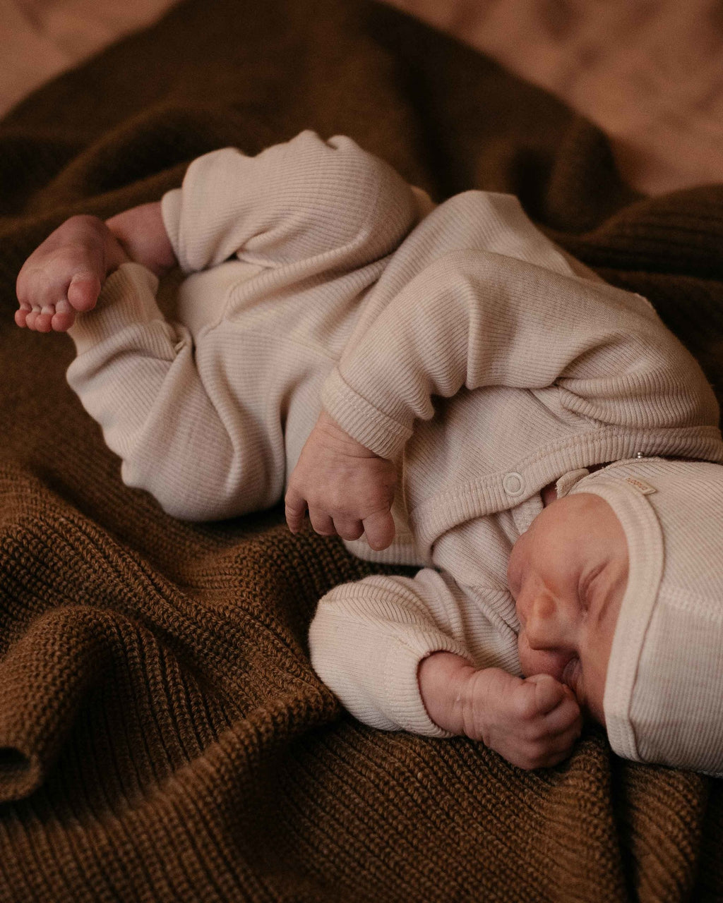 Unaduna baby wikkel truitje wol mazarin wit