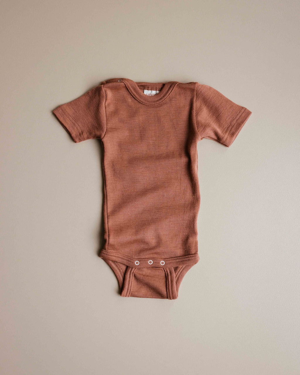 unaduna-sienna-clay-baby-body-short-sleeve-wool-si